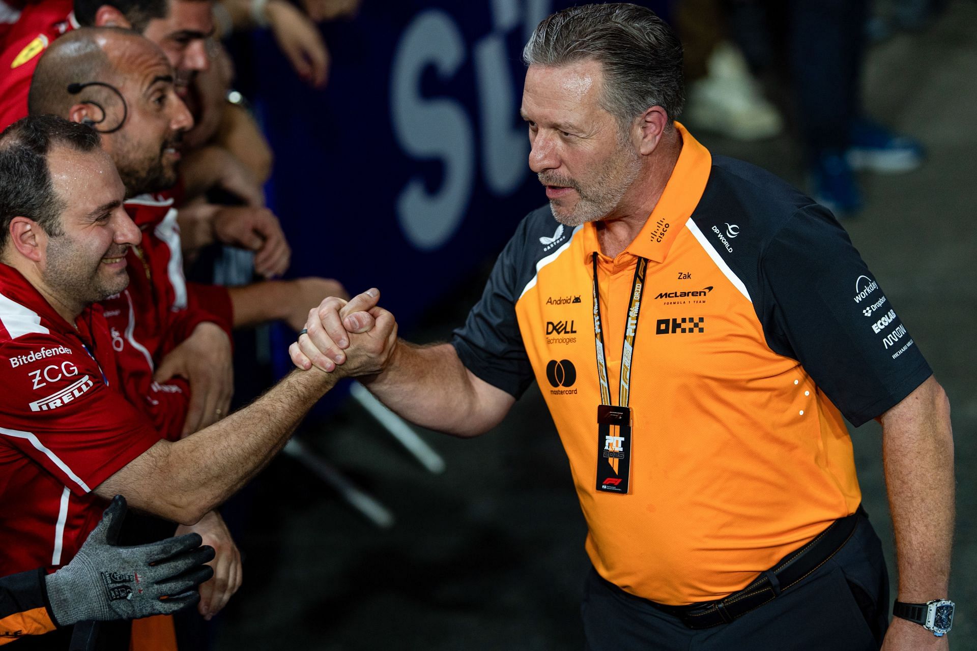 Zak Brown shakes the hand of a Ferrari team member in parc ferme during the F1 Grand Prix of Saudi Arabia - Source: Getty